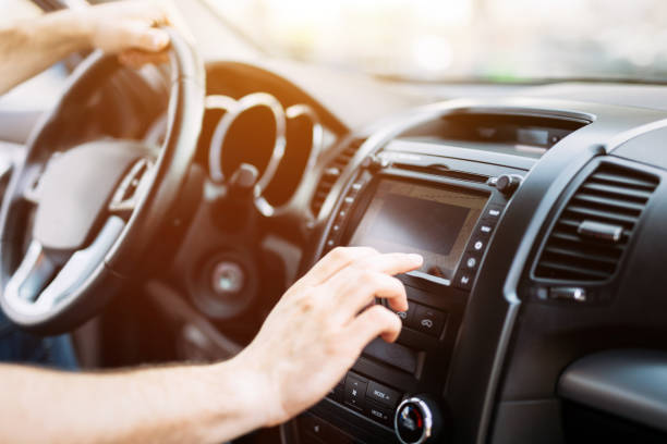 Man using navigation system while driving car Man using navigation system while driving car vehicle interior audio stock pictures, royalty-free photos & images