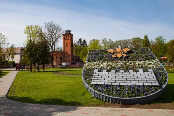 Old fire station and park with flower composition. Daugavpils, Latvia.