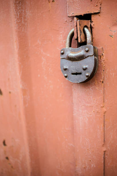 istock The old door locked with a padlock hanging brackets. Set of backgrounds 680720558