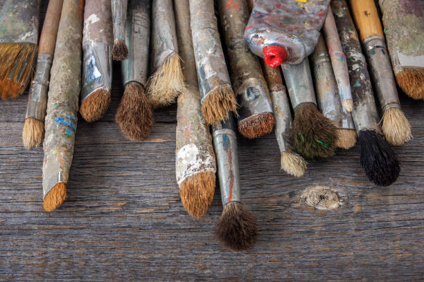 istock Old brushes and tube with paint 680721490