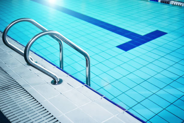 The swimming pool ladder stock photo