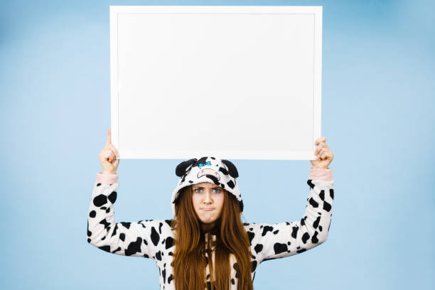 istock Funny girl with blank empty banner board. 680737044