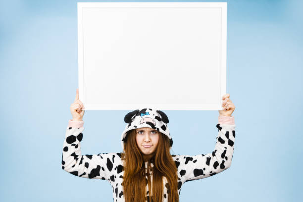 istock Funny girl with blank empty banner board. 680738042