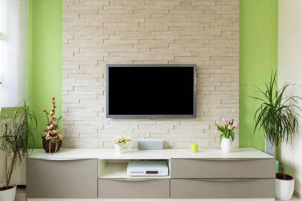 istock Modern living room interior - tv mounted on brick wall with black screen 680751324