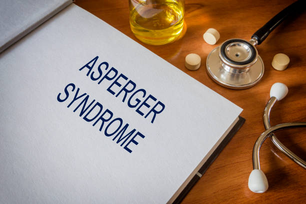 istock Asperger syndrome written on book with tablets. Medicine concept. 680751596