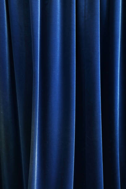 istock Heavy dark blue pleated textile curtain background 680751658