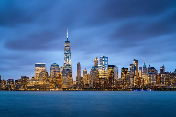 Beautiful illuminated New York City Skyline with Freedom Tower - One World Trade Center at Night. Manhattan, New York City, USA