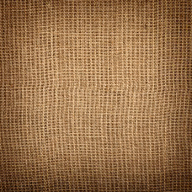 istock Brown burlap jute canvas background with shade 680751994