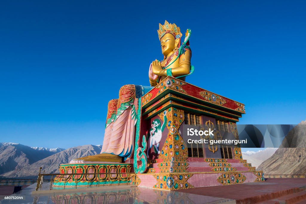 Huge statue of Maitreya Buddha in Nubra Valley, Ladakh, India Huge statue of Maitreya Buddha (the future Buddha) near Diskit Monastery in the hidden Nubra Valley facing down the Shyok River towards Pakistan. The statue is 32 meters (106 ft) high. Diskit monatery (gompa)  is the oldest and largest Buddhist monastery in the Nubra Valley of Ladakh and it It belongs to the Gelugpa (Yellow Hat) sect of Tibetan Buddhism. 



 Ladakh Region Stock Photo