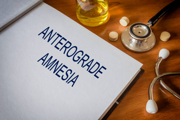 istock anterograde amnesia written on book with tablets. Medicine concept 680752114