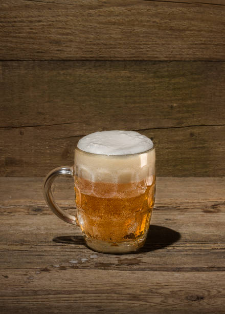 istock Beer mug on a wooden background 680757204