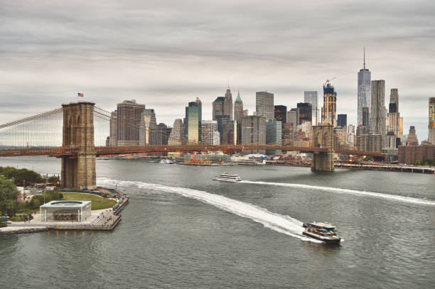 istock Manhattan with Brooklyn Bridge at twilight. 680757296