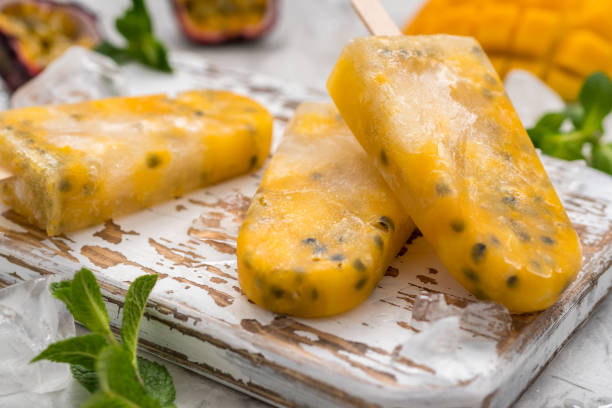 istock Homemade frozen popsicles with fresh mango and passion fruit 680758258