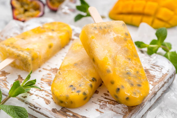 istock Homemade frozen popsicles with fresh mango and passion fruit 680758296