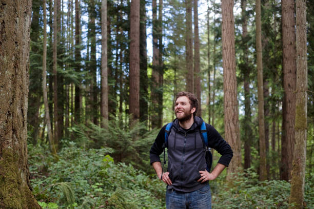 istock Young Man Smiles in Nature 680766598
