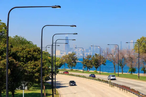 Chicago skyline seen from Lakeshore Drive in the South Side of Chicago, IL, USA.
