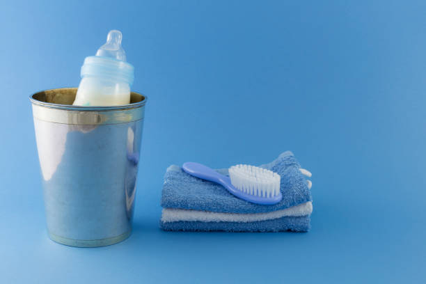 istock Baby boy luxury items on pale blue background 680770206