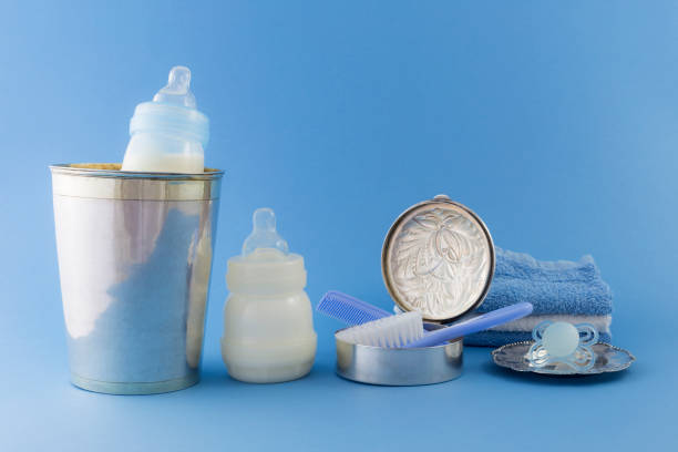 istock Baby boy luxury items on pale blue background 680771368