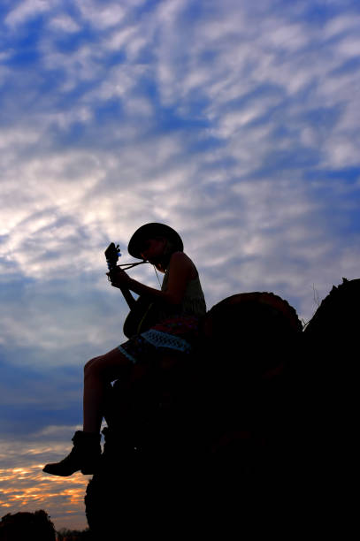 istock Cowgirl and Guitar 680775858