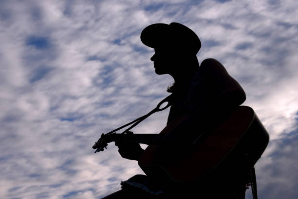 istock Cowgirl and Guitar 680775916