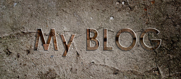 The header of a personal blog is made on textured concrete surface three-dimensional letters