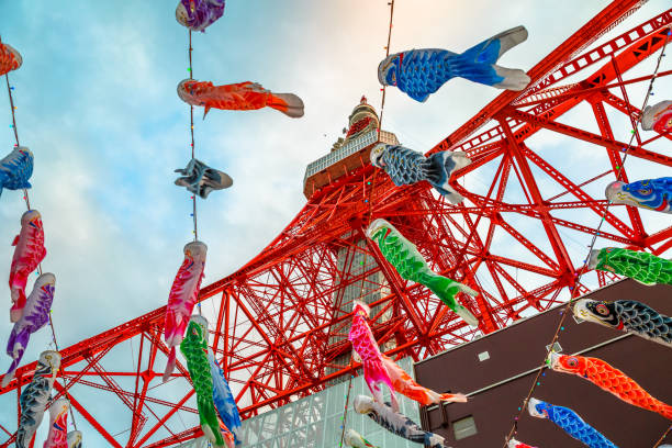 Koinobori at Tokyo Tower Tokyo, Japan - April 23, 2017: bottom view of colorful Koinobori at Tokyo Tower. Koinobori are carp-shaped wind socks traditionally flown in Japan to celebrate Children's Day during the Golden Week. childrens day photos stock pictures, royalty-free photos & images