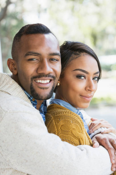 istock Affectionate young mixed race couple on front porch 680789170