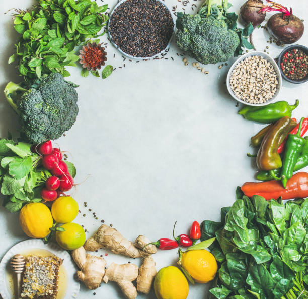 istock Clean eating healthy cooking ingredients over grey marble background 680789478