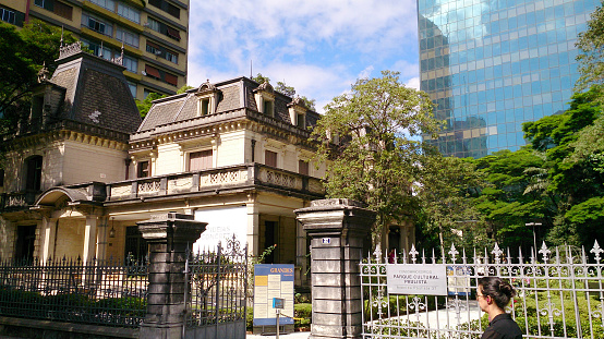 Casa das Rosas, a cultural and literary center at Paulista Avenue in Sao Paulo, Brazil with modern buildings around.