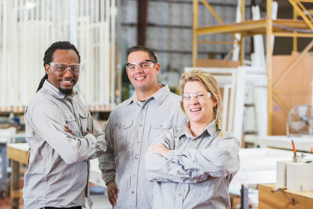 istock Woman and two men working in shutter factory 680790280