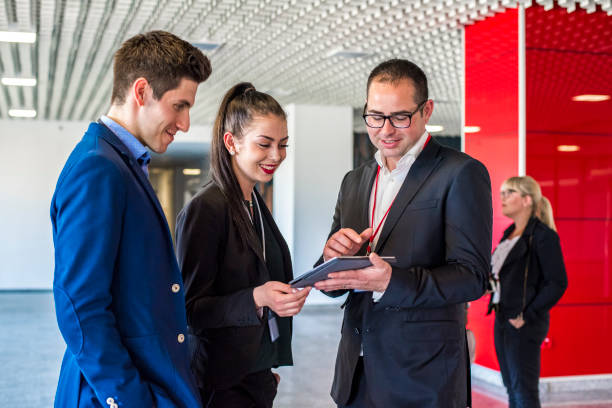istock Young business colleagues standing in the lobby 680794456