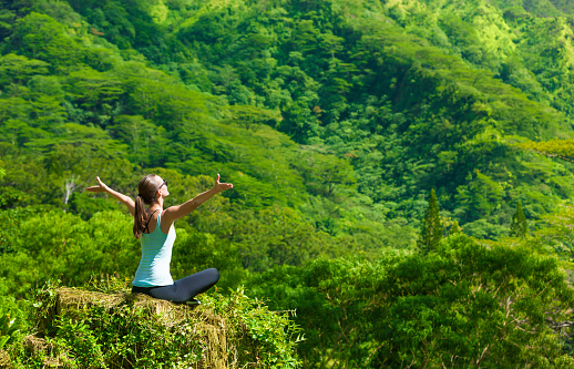 Happy woman in a beautiful nature setting. Active lifestyle concept.