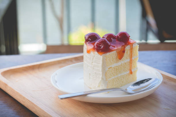 istock Sponge cake with cherry syrup in cozy outdoor cafe. 680796168