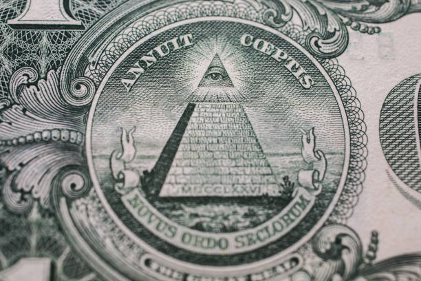 istock all-seeing eye, truncated pyramid closeup, money background ,one dollar bill down back reverse side, background of dollars, close up, America 680809928