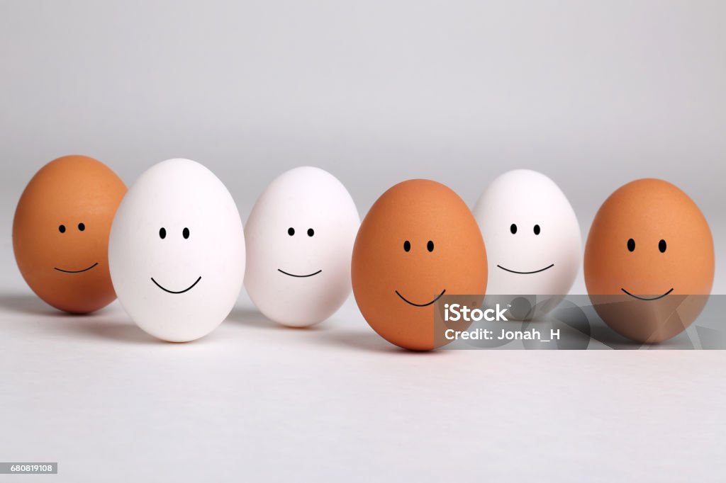 Racial harmony concept photo A group of smiling brown and white eggs representing racial harmony, diversity, integration, and tolerance. Canada Stock Photo