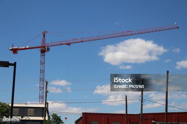 Tall Cranes In Richmond Virginia Warehouse Area Stock Photo - Download Image Now - Apartment, Business Finance and Industry, Construction Industry