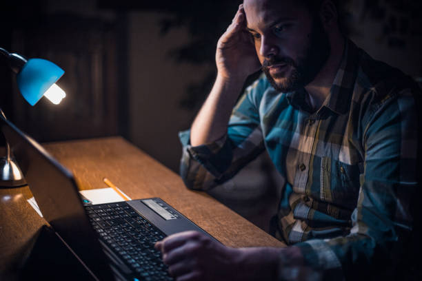 istock Young bearded man checking his bank account online 680819910