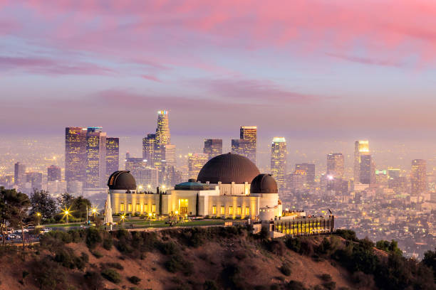 The Griffith Observatory and Los Angeles city skyline The Griffith Observatory and Los Angeles city skyline at twilight observatory photos stock pictures, royalty-free photos & images