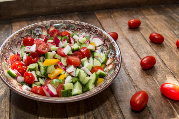istock Vegetables spring salad on wooden tray 680826518