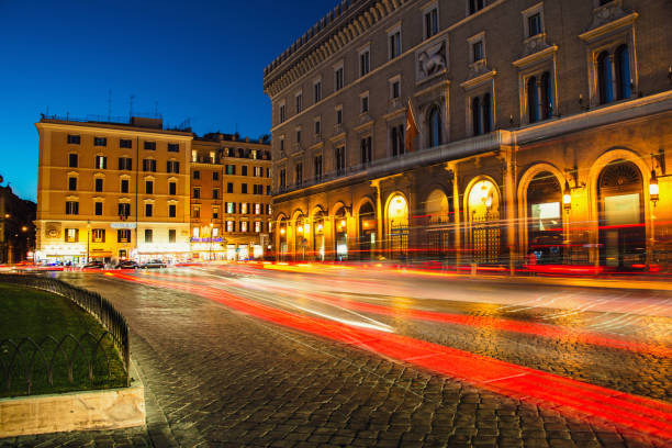 Venezia Square /Piazza Venezia/ in Rome, Italy at night. Long exposure, car lights trails effect.