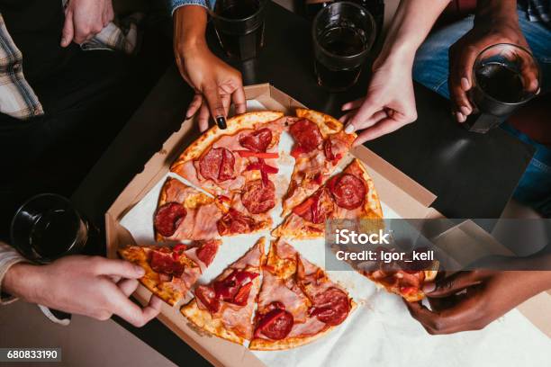 Four Friends Company Eat Fresh Pizza At Home Stock Photo - Download Image Now - Pizza, Party - Social Event, Eating