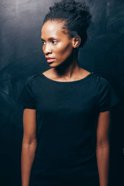 istock Pretty afroamerican woman on dark background 680833538