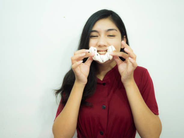istock Asian woman and donut 680833846