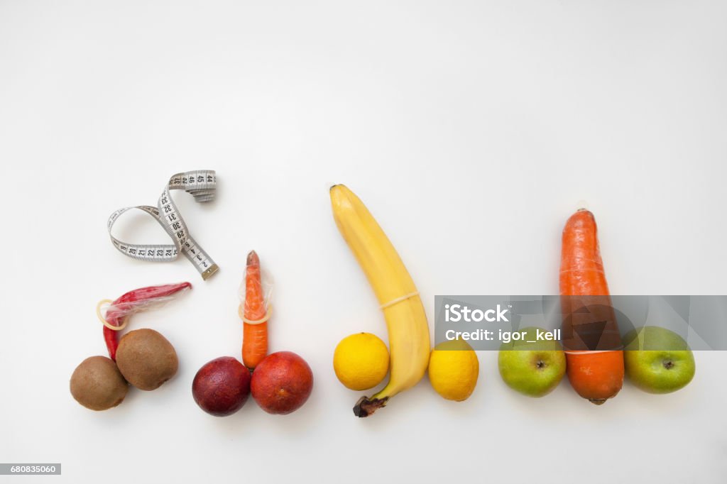 Penis measure. Phallus with erection in condoms Penis measure, man power and potency, size. Four phallus with strong erection in condoms with tape on white background. Penis Stock Photo