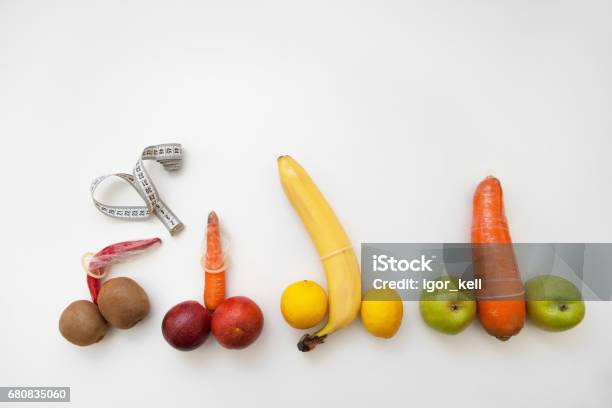 Penis Measure Phallus With Erection In Condoms Stock Photo - Download Image Now - Penis, Large, Fruit