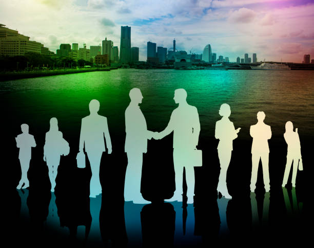 istock business people silhouettes and modern cityscape 680847444