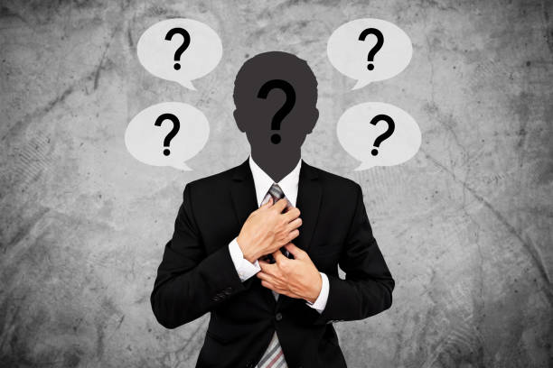 istock Unidentified businessman with question marks on head, and text bubbles 680850472