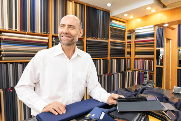 istock Business Man Selecting Fabric For a Custom Tailored Suit 680865670
