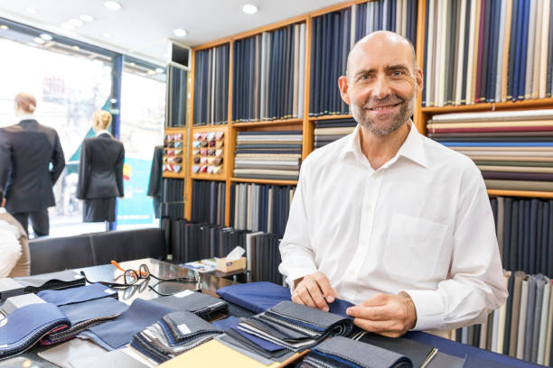 istock Business Man Selecting Fabric For a Custom Tailored Suit 680865684