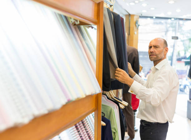 istock Business Man Selecting Fabric For a Custom Tailored Suit 680865750